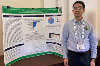 Stevephen Hung standing with his research poster